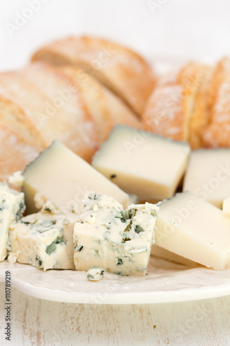 cheese with bread on white dish on white background