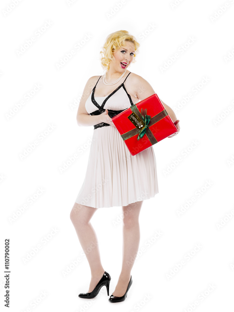 happy young woman posing with her christmas present. happy young woman posing with her christmas present.