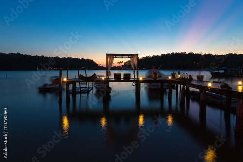 Thai terrace lounges with pergola at sunset on wooden pier in Ko © piccaya