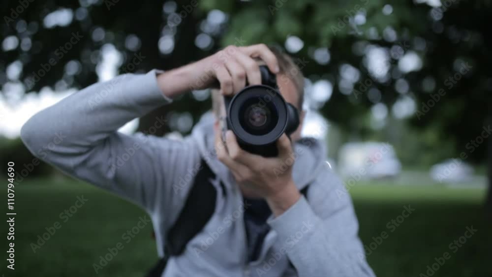 A Large Portrait Of A Man With A Professional SLR Camera In Hand A Large Portrait Of A Man With A Professional SLR Camera In Hand