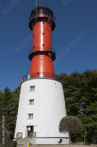 Lighthouse on a sunny day with blue sky.