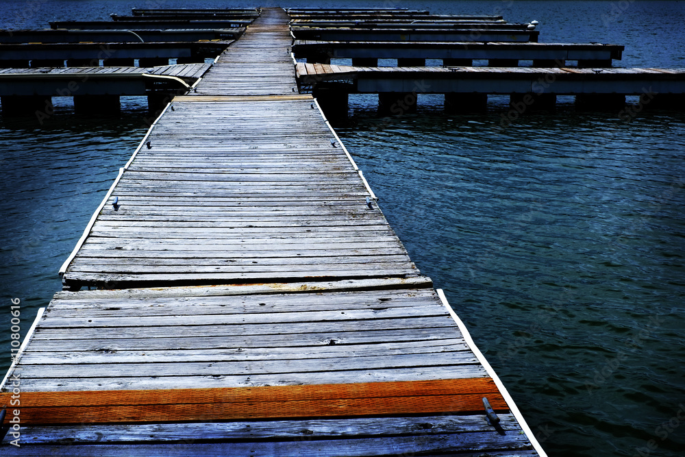 Fototapeta premium Old Wooden Dock by Water