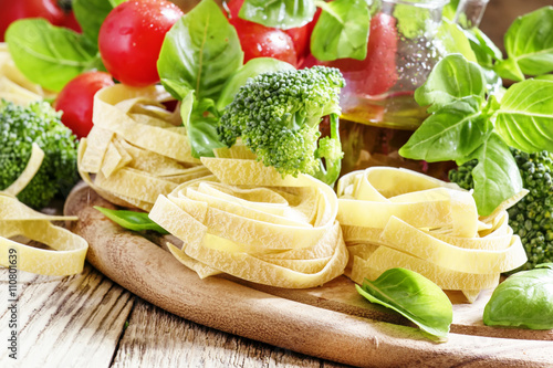 Ingredients for cooking pasta fettuccine with broccoli, tomatoes