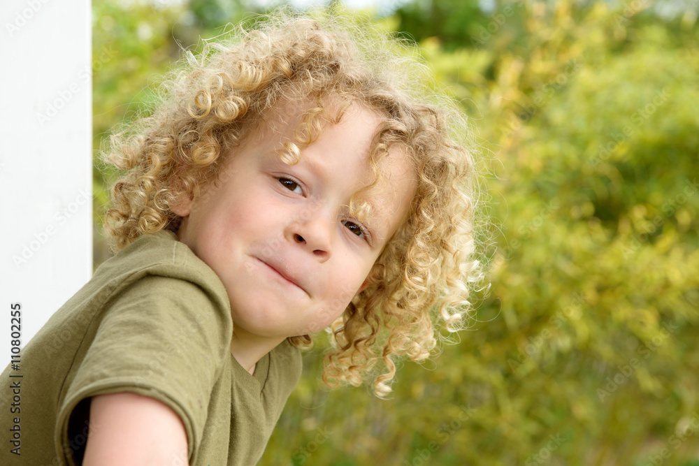 portrait of a young boy with blond curly hair portrait of a young boy with blond curly hair