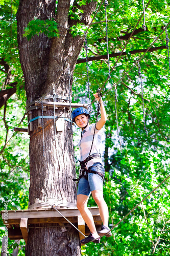 adventure climbing high wire park - people on course in mountain