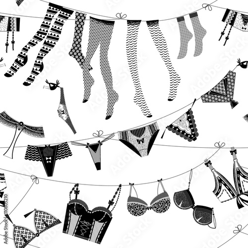 Laundry drying on a washing lines. Black and white lingerie. Background pattern