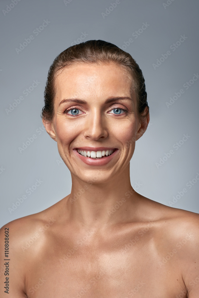 Portrait of smiling woman with bare shoulders Portrait of smiling woman with bare shoulders