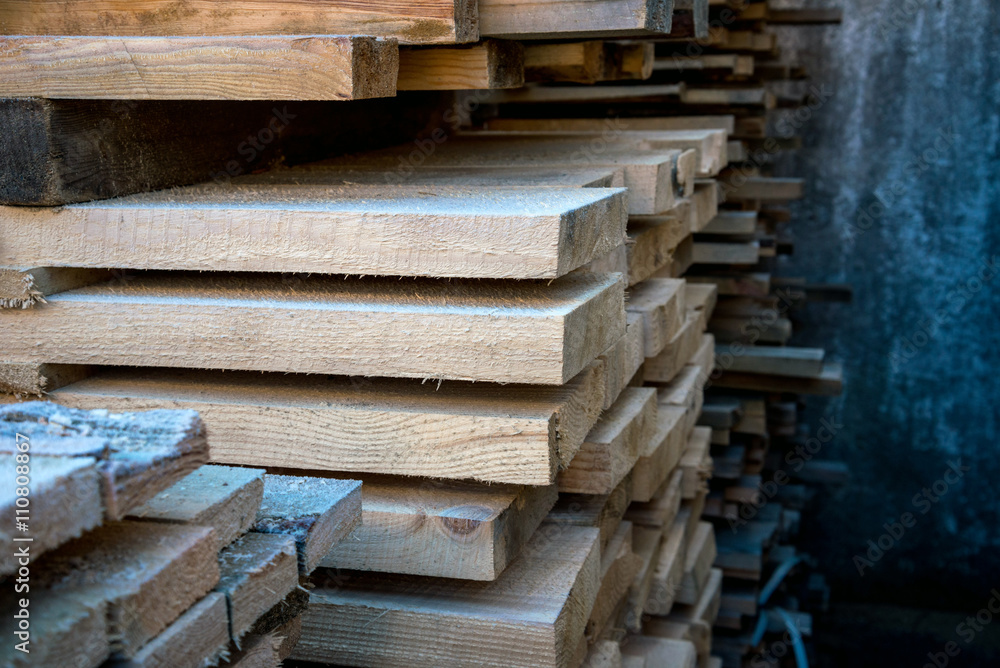 Planks in manufacturing. Boards stacked in a pack Planks in manufacturing. Boards stacked in a pack