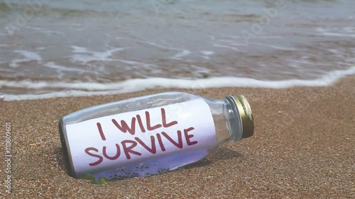 I will survive concept written in a bottle washed ashore photo