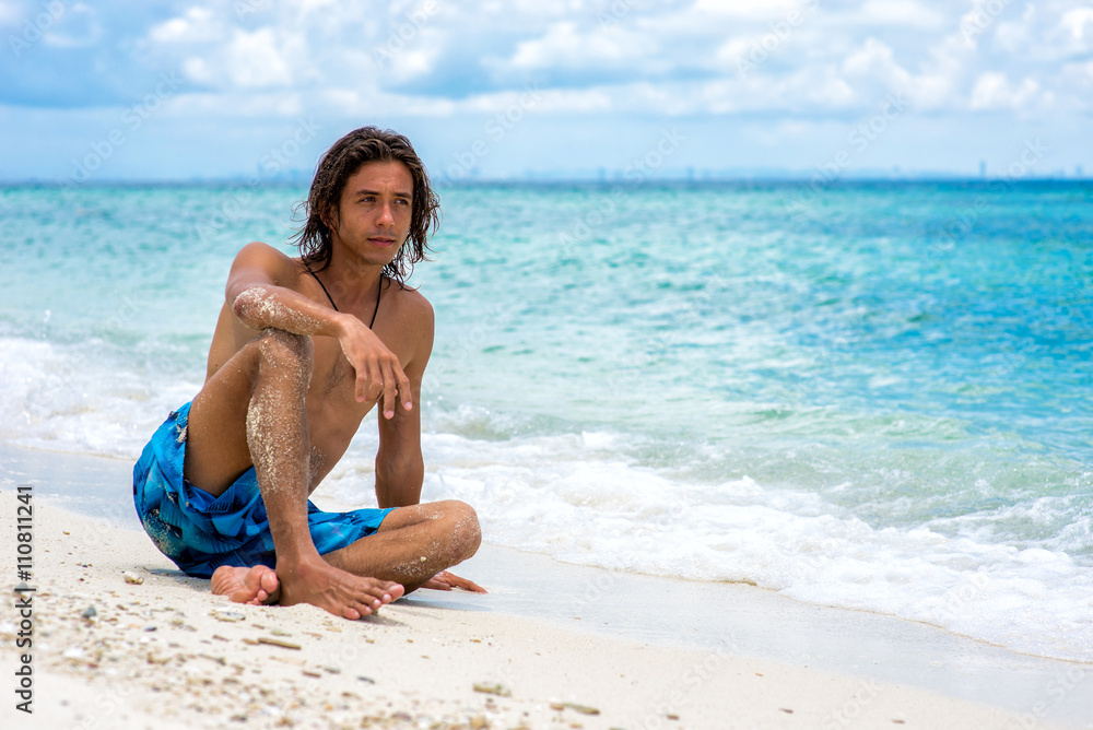 The guy sitting on the beach The guy sitting on the beach