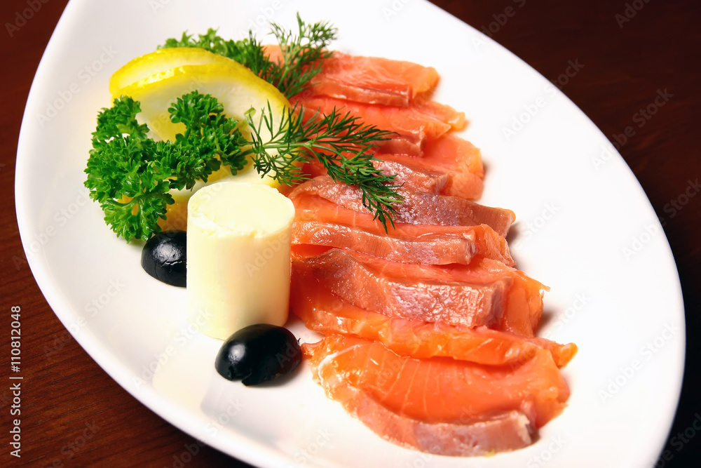 Slices of salmon on a plate Slices of salmon on a plate