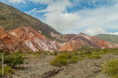 Colorful rock formations near Purmamarca village (Quebrada de Humahuaca valley), Argentina photo