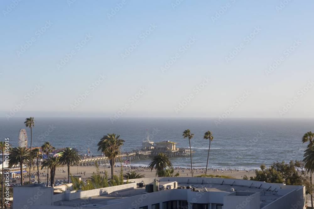 Amusement Park on the Pacific ocean, the beach landscape. The ocean, beach and blue sky in USA, Santa Monica.