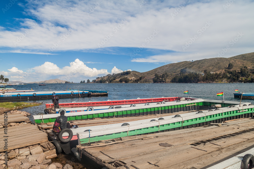 Rafts are prepared for transport of vehicles across the Tiquina strait at Titicaca lake, Bolivia