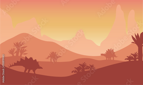 At sunset silhouette of stegosaurus