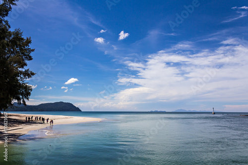Fototapeta Naklejka Na Ścianę i Meble -  Seascape with tourists and lighthouse - Tarutao islands, Thailand