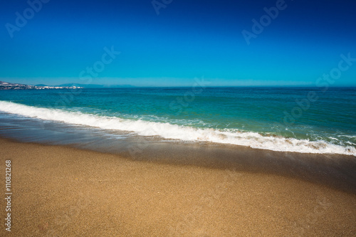 Sea Ocean Waves Wash Over Golden Sand Background