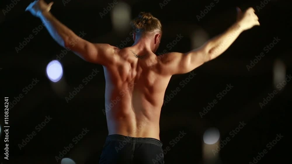 Muscular young sexy naked cute man. male striptease dancing. flashes of