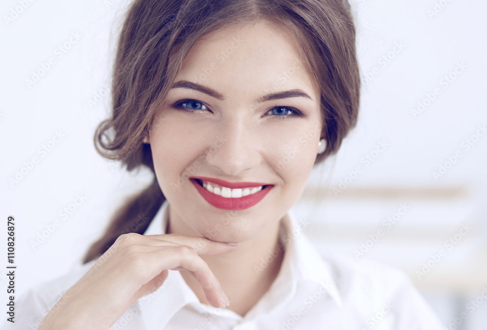 Attractive businesswoman sitting in the office Attractive businesswoman sitting in the office