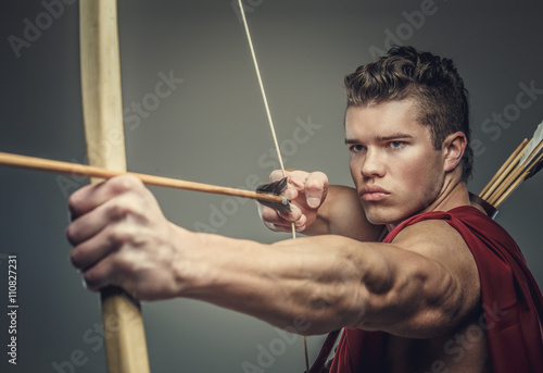 Photography Muscular male model with bow.