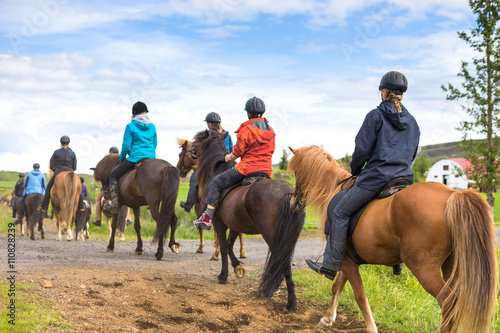 Group of horseback riders ride  in Iceland © lkoimages