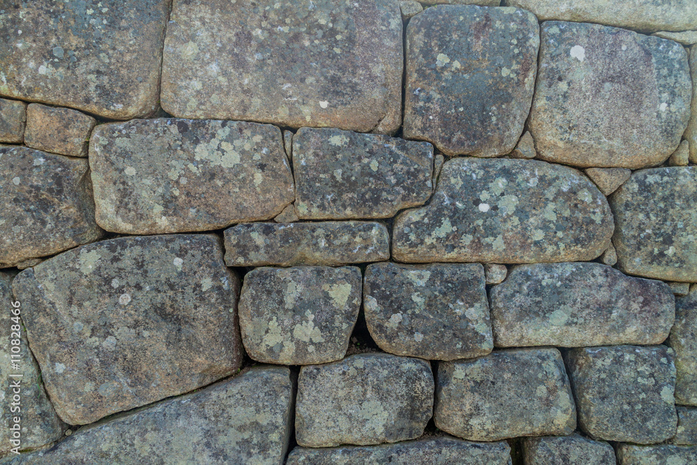 Detail of a stone wall of an agricultural terrace at Machu Picchu ruins, Peru Detail of a stone wall of an agricultural terrace at Machu Picchu ruins, Peru