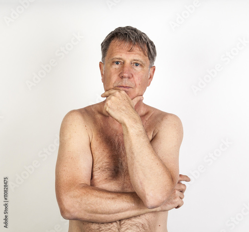 man with crossed arms thinking