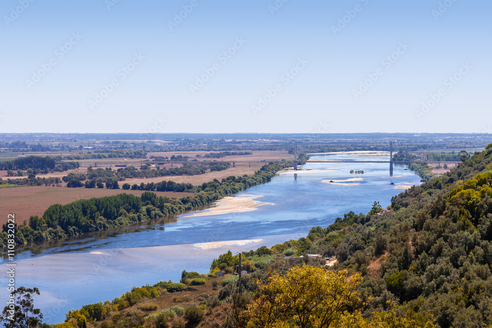 The Tagus River (Rio Tejo), the largest of the Iberian Peninsula, and the Leziria landscape seen from Portas do Sol belvedere. Santarem, Portugal.