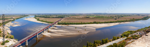 Santarem, Portugal. Dom Luis I Bridge crossing the Tagus River (Rio Tejo), the largest of the Iberian Peninsula, with the Leziria landscape seen from Portas do Sol belvedere. photo