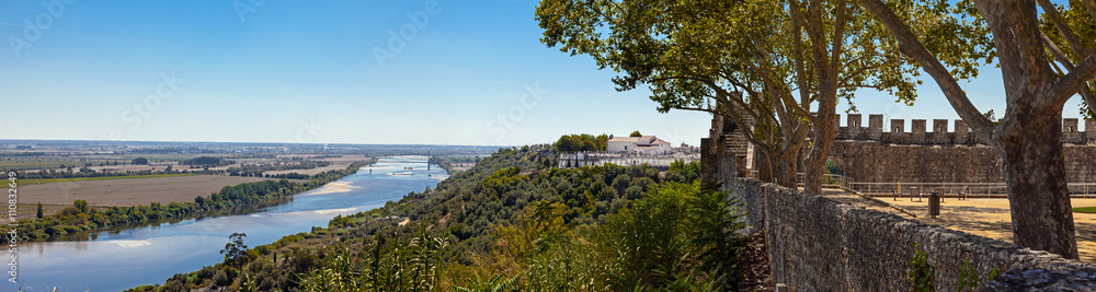 The Tagus River (Rio Tejo), the largest of the Iberian Peninsula, and the Leziria landscape seen from castle walls in Portas do Sol belvedere. Santarem, Portugal.