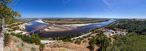 Santarem, Portugal. The typical Leziria alluvial plane landscape from the Ribatejo region with the Dom Luis I Bridge crossing the Tagus River, the seen from Portas do Sol belvedere.