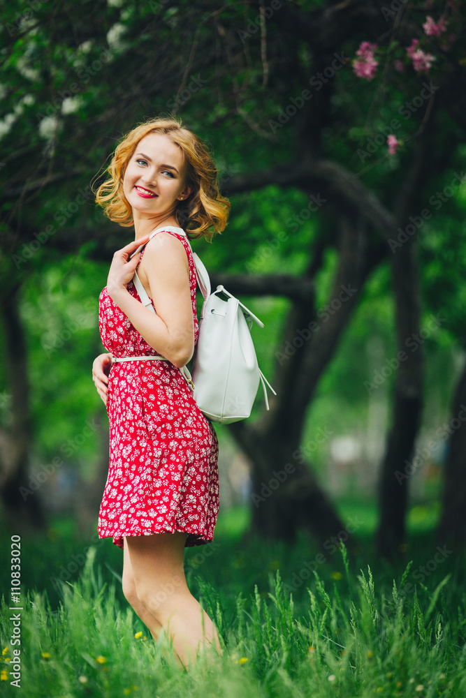the girl with the backpack in the Apple orchard the girl with the backpack in the Apple orchard