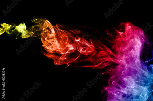 Colored abstract smoke, isolated on black background. Photo. Neon.