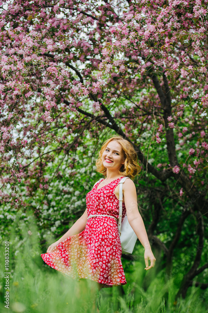the girl with the backpack in the Apple orchard the girl with the backpack in the Apple orchard