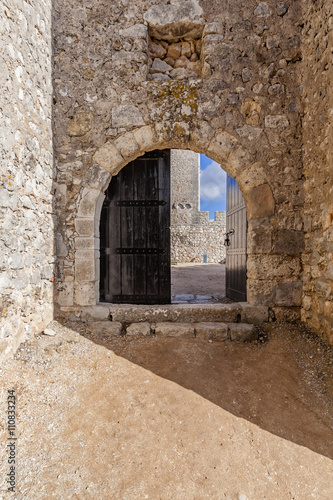 Open gate of the Sesimbra castle  Portugal.