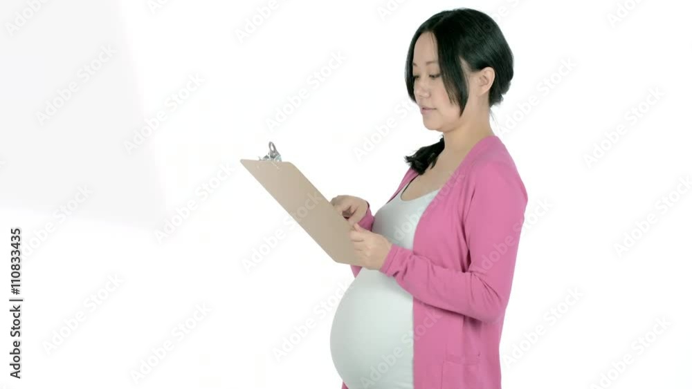 Pregnant adult asian woman isolated on a white background Pregnant adult asian woman isolated on a white background