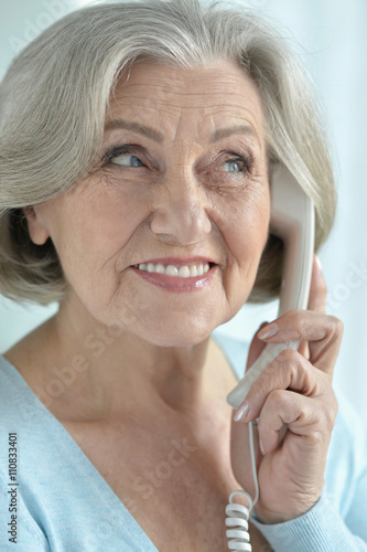 Senior woman talking phone 