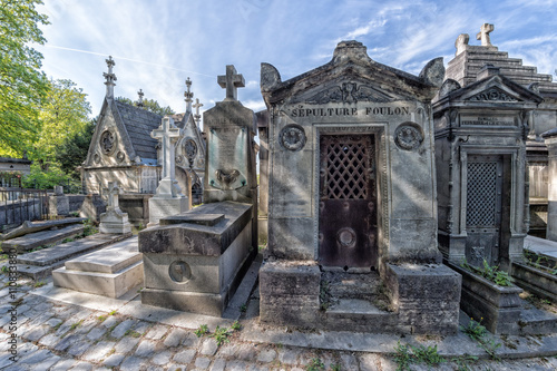 PARIS, FRANCE - MAY 2, 2016: old graves in Pere-Lachaise cemetery photo