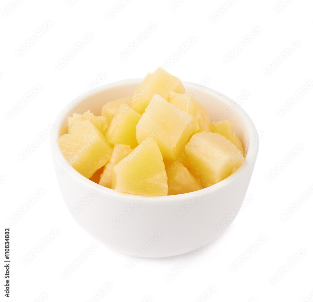 Pile of canned pineapple over isolated white background Pile of canned pineapple over isolated white background