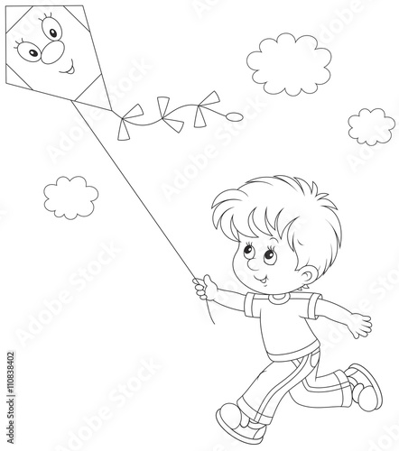 Little boy flying a kite