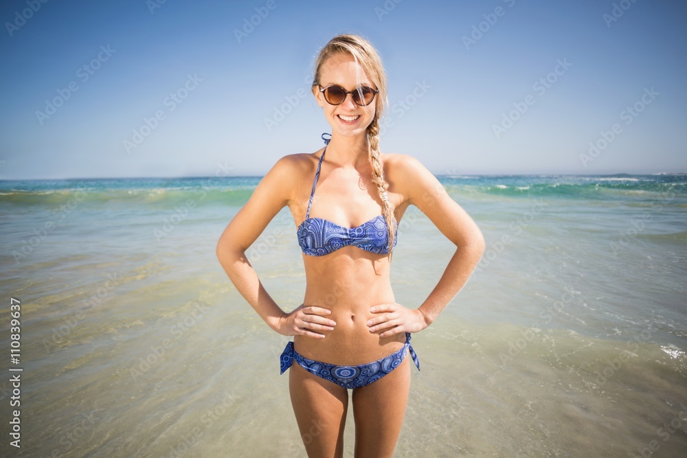 Portrait of happy woman standing on the beach Portrait of happy woman standing on the beach