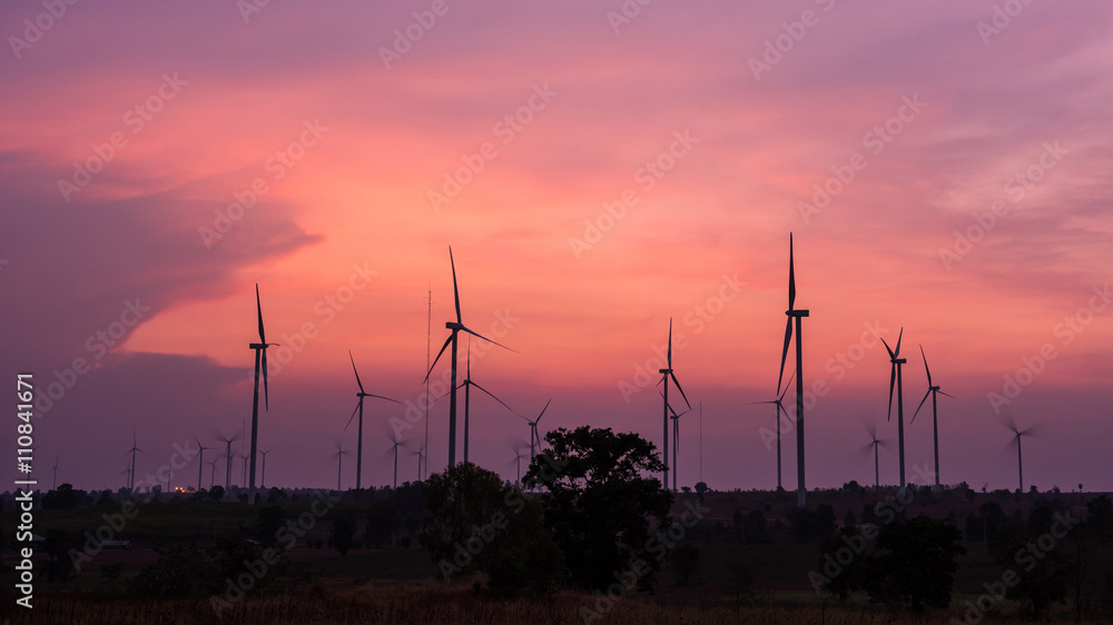 Obraz premium Wind turbine power generator at twilight