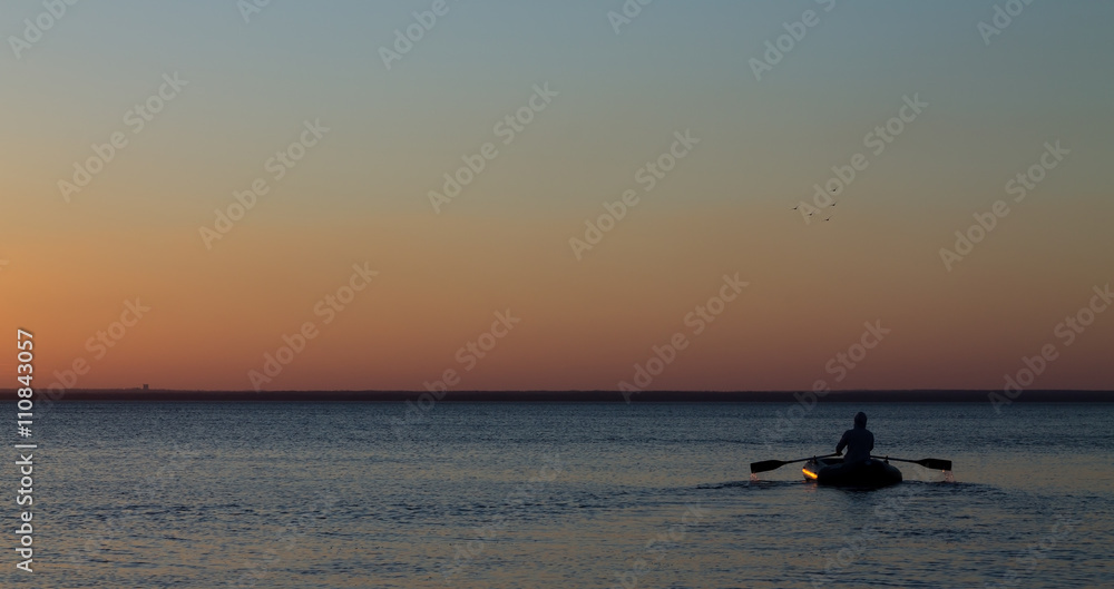 Fototapeta premium Man with the oars on the water in the sea