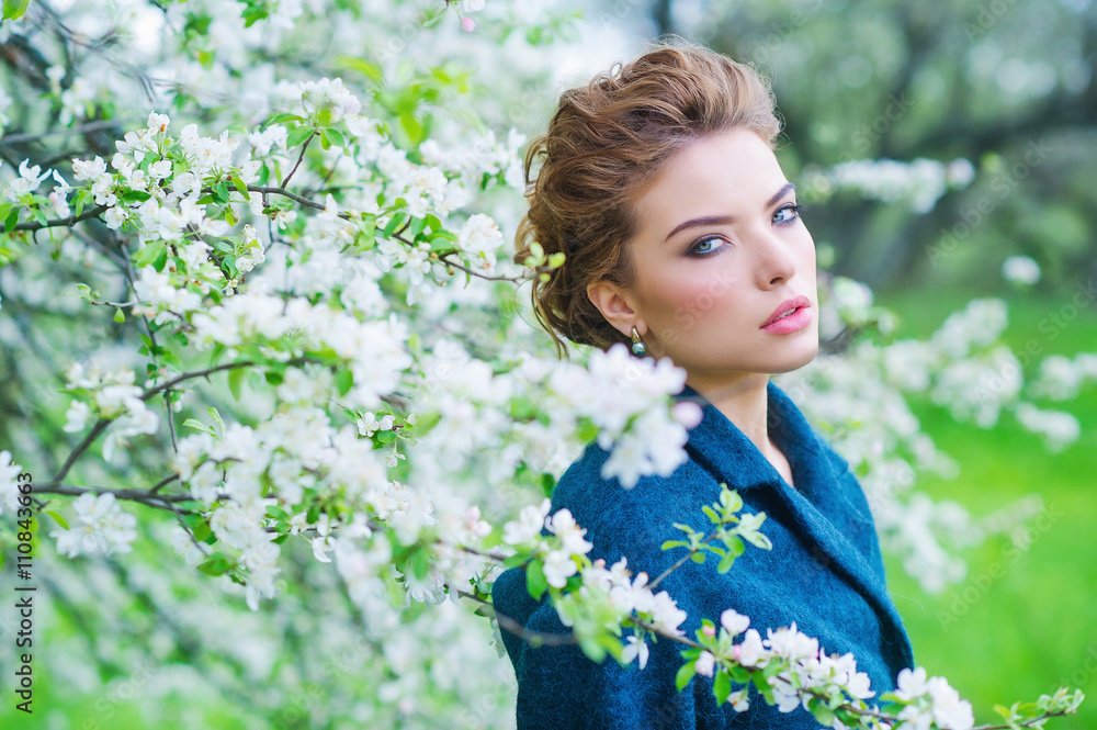 Gorgeous woman beauty portrait in spring blooming garden Gorgeous woman beauty portrait in spring blooming garden