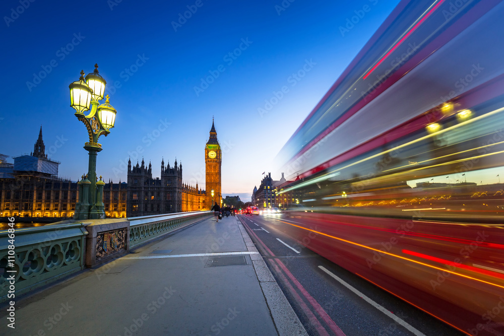 London scenery at Westminter bridge with Big Ben and blurred red bus, UK