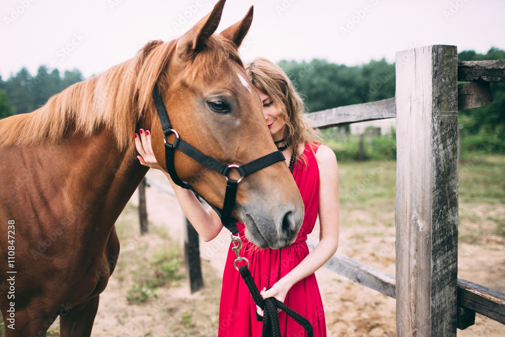 Fototapeta premium happy woman enjoys with her favorite horse