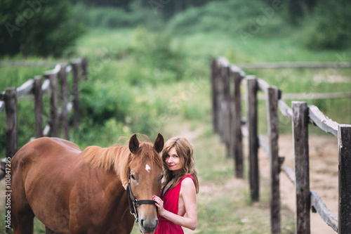 portrait of a girl who walks on nature with a wonderful animal