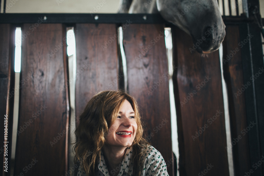 cheerful young girl is happy with horse cheerful young girl is happy with horse