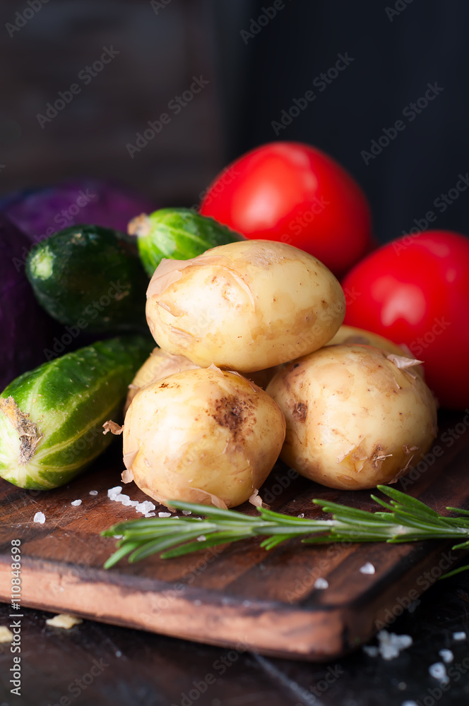 Young potatoes on wooden table Young potatoes on wooden table