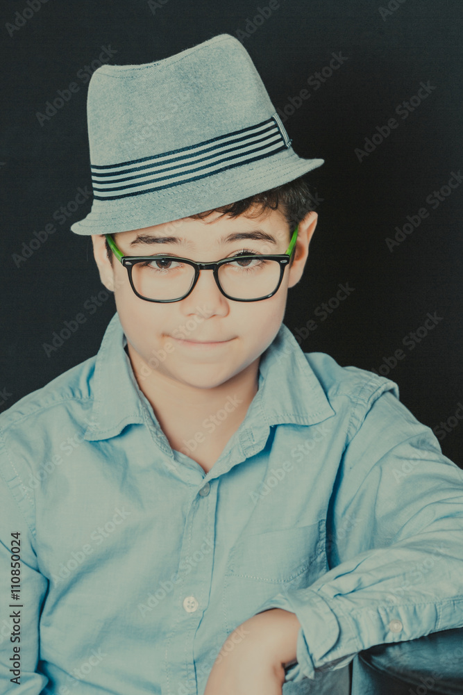 portrait of a young man with glasses and hat portrait of a young man with glasses and hat